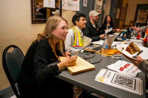 Chapman signs a “Certificate of Appreciation” 