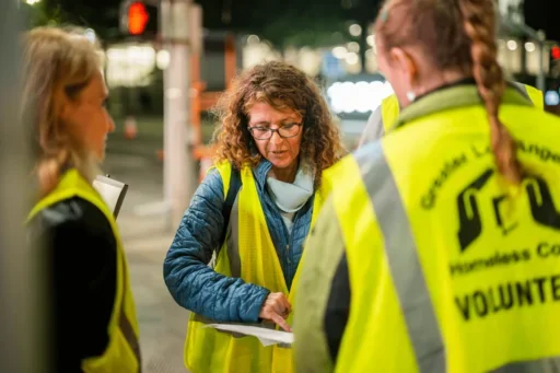 Jennifer Poulakidas maps out a route with the other volunteers