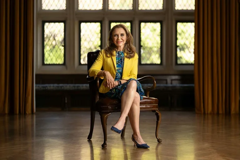 Felicia M Knaul sitting in chair